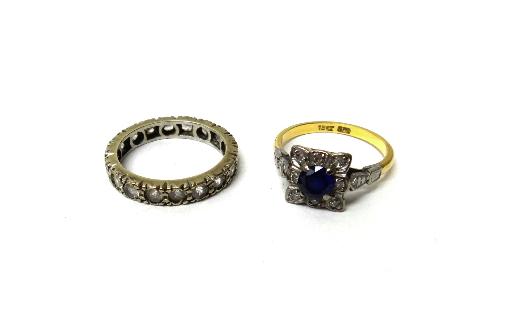 Appraisal: A gold diamond and synthetic sapphire set square cluster ring