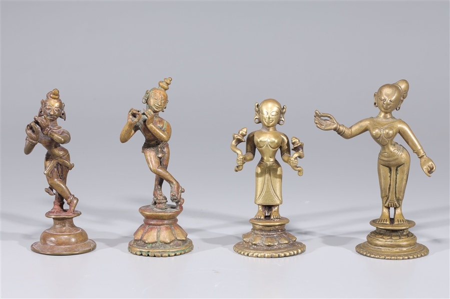 Appraisal: Group of four antique Indian figures including two Krishna statues