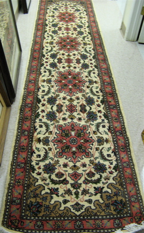 Appraisal: HAND KNOTTED ORIENTAL CORRIDOR CARPET Pakistani Persian floral and four