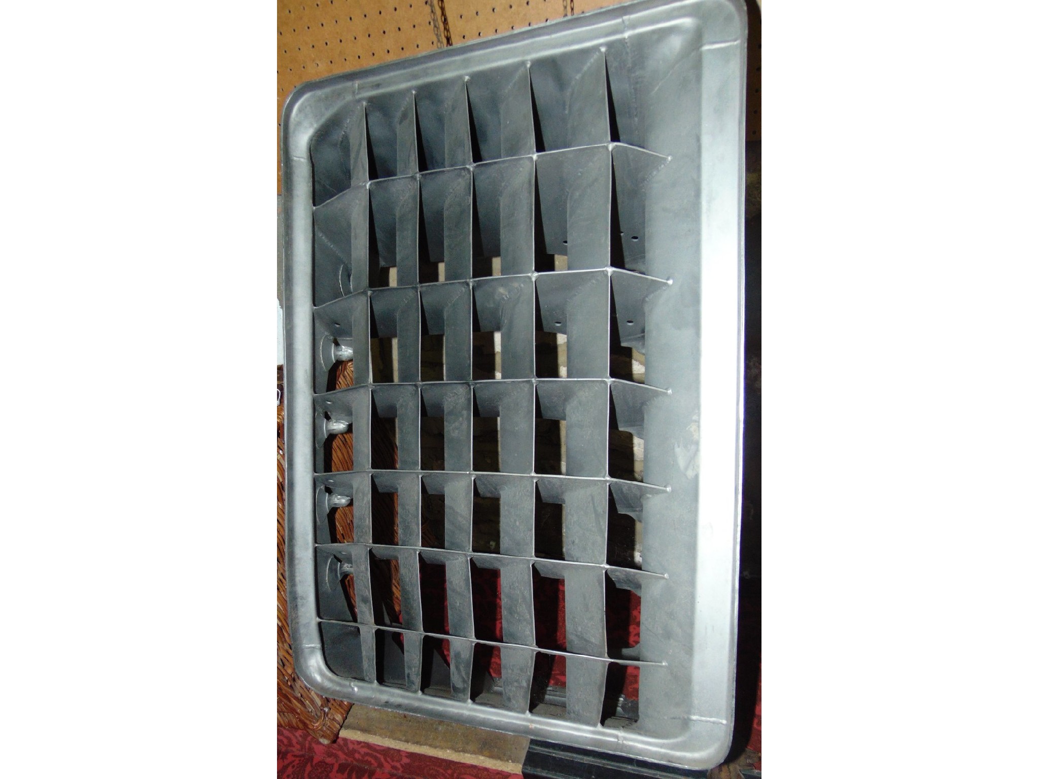 Appraisal: A large contemporary cast metal ventilation grid believed to originate