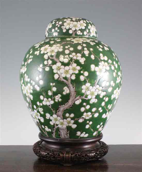 Appraisal: A Chinese enamelled porcelain 'prunus' jar and cover with wood