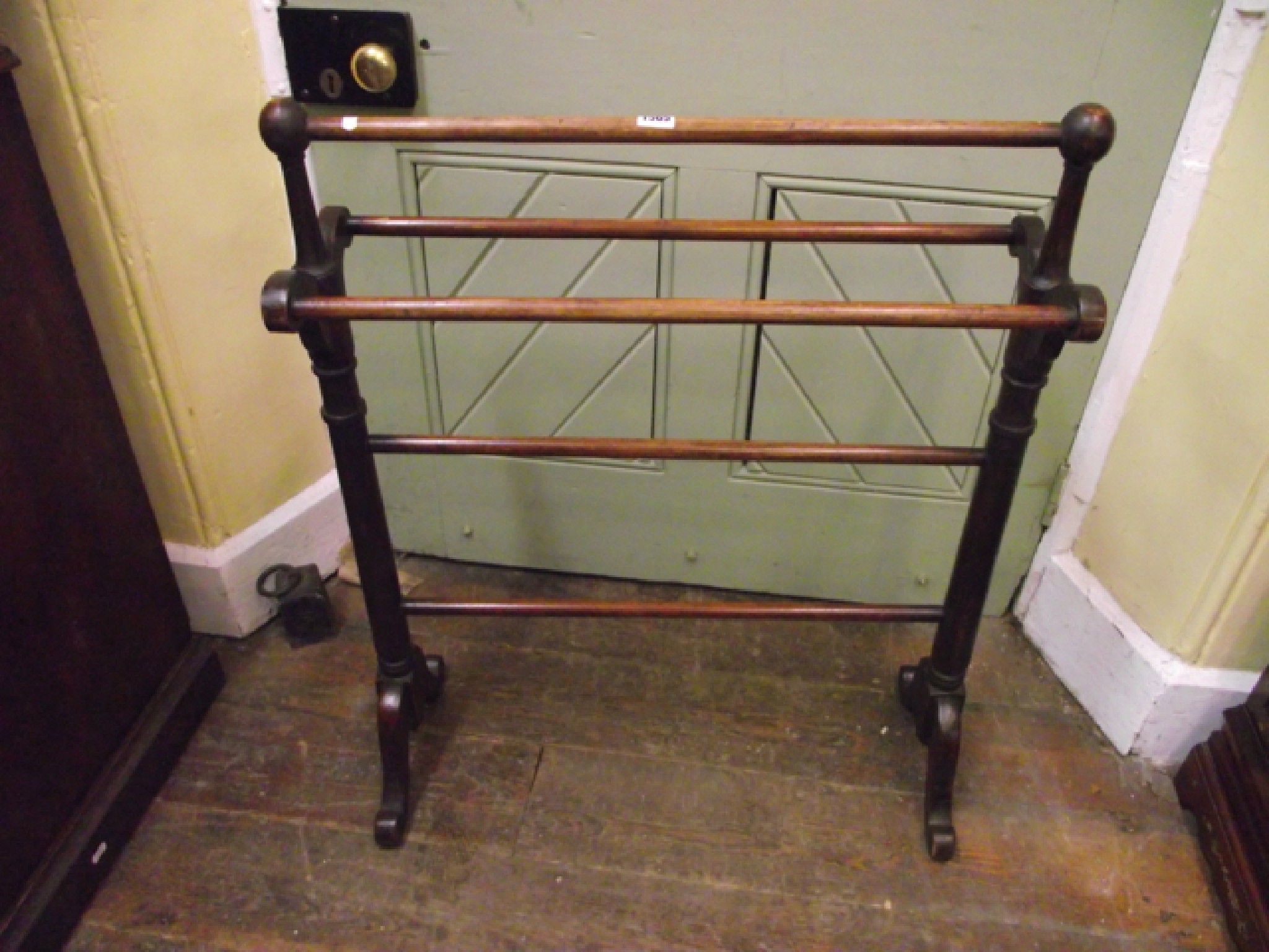 Appraisal: A simple Victorian mahogany towel rail on turned supports