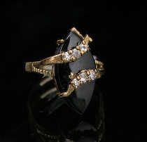 Appraisal: A Ladies' Gold and Onyx Ring Yellow gold ring set