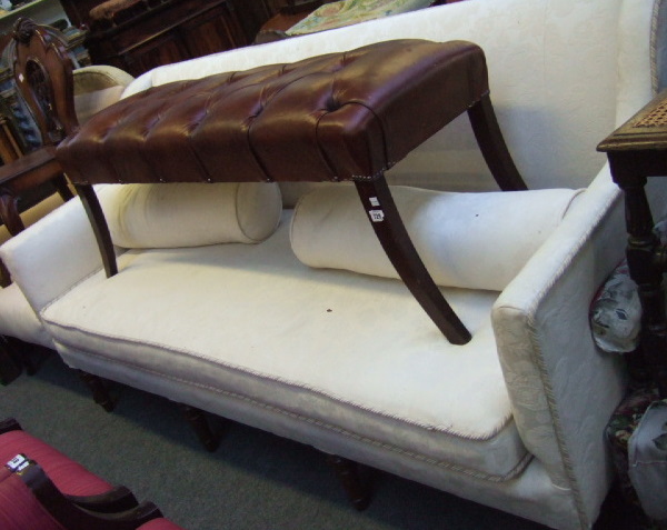 Appraisal: A th century framed sofa the rectangular back over downswept