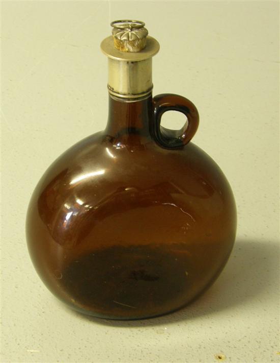 Appraisal: Victorian brown glass bottle with silver mount London h in