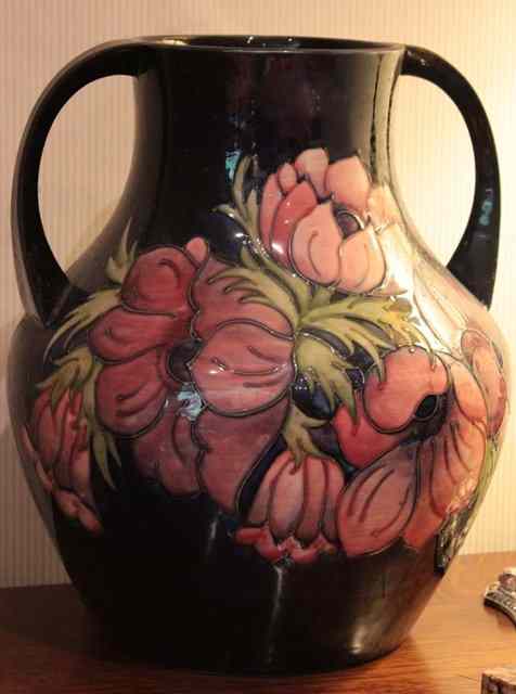 Appraisal: A MOORCROFT OVOID VASE with narrow neck and scrolling handles