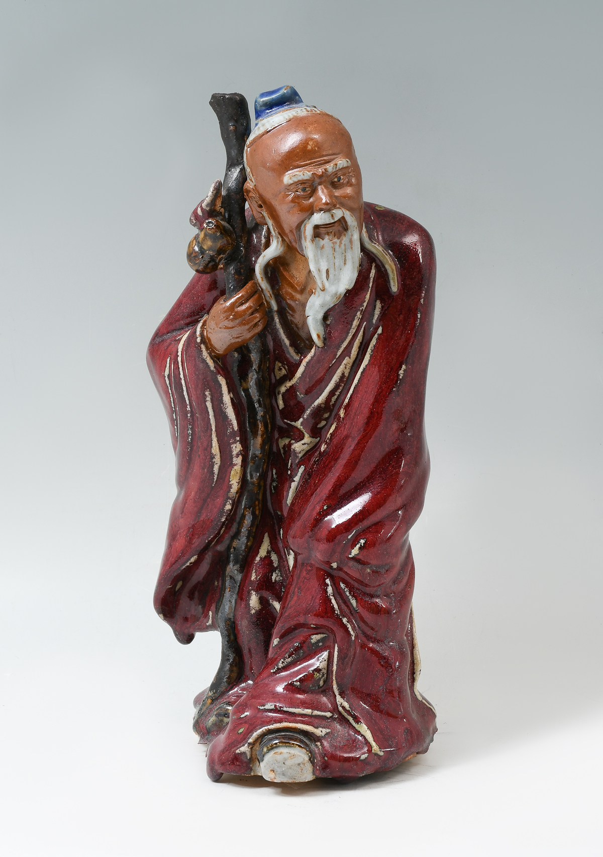 Appraisal: CHINESE CONFUCIUS SCULPTURE Polychrome enameled Chinese sculpture of an Immortal