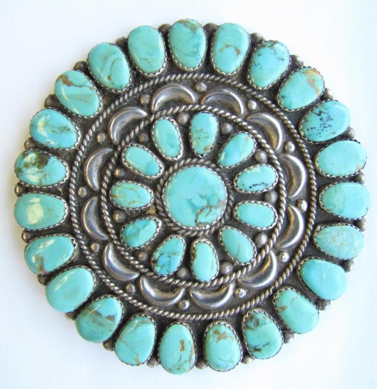 Appraisal: A large sterling silver petit point turquoise pin by Justin