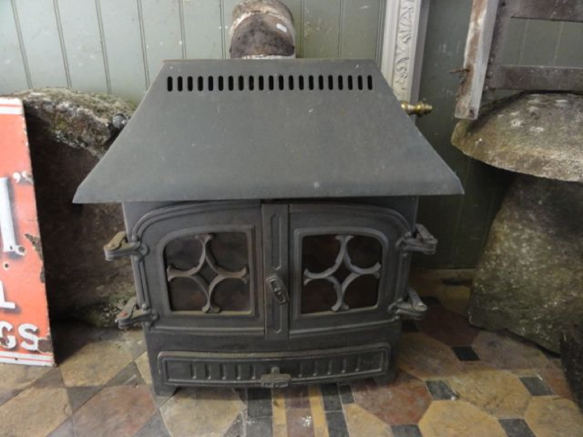 Appraisal: A Hamlet wood burner enclosed by a pair of arched