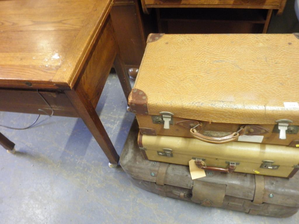 Appraisal: A leather trunk two canvas and leather suitcases and a