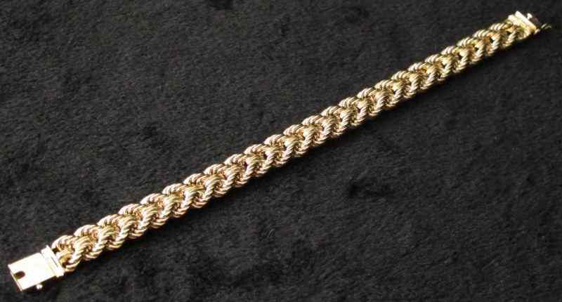 Appraisal: Gold Braceletof braided form with box clasp and safety catch