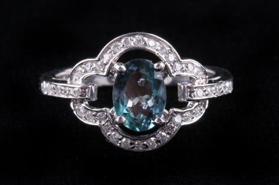 Appraisal: K WHITE GOLD ALEXANDRITE AND DIAMOND RING Oval color change