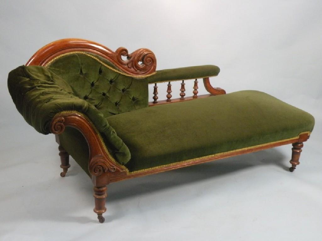 Appraisal: A Victorian mahogany chaise longue the scroll carved back with