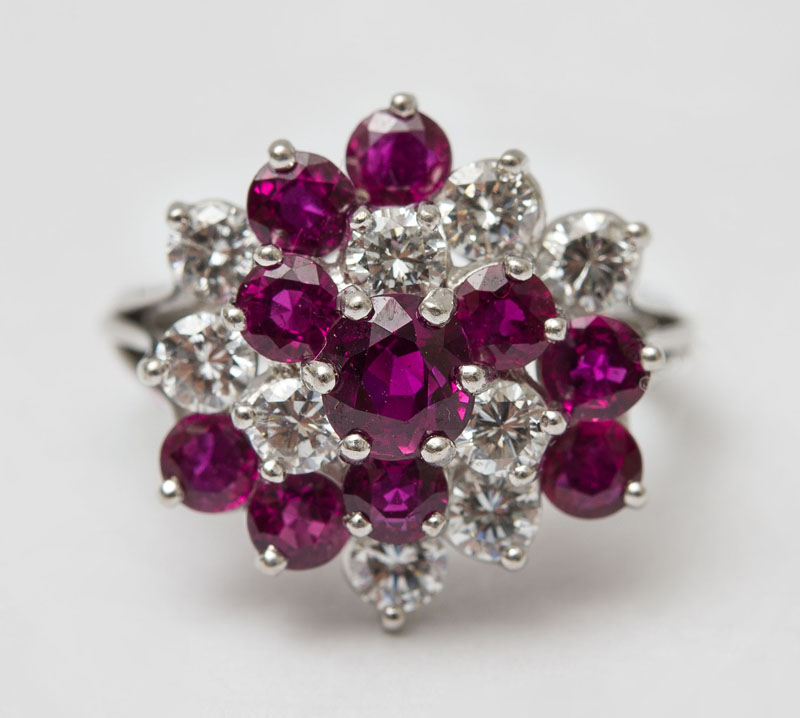 Appraisal: PLATINUM DIAMOND AND RUBY COCKTAIL RING Set with round diamonds