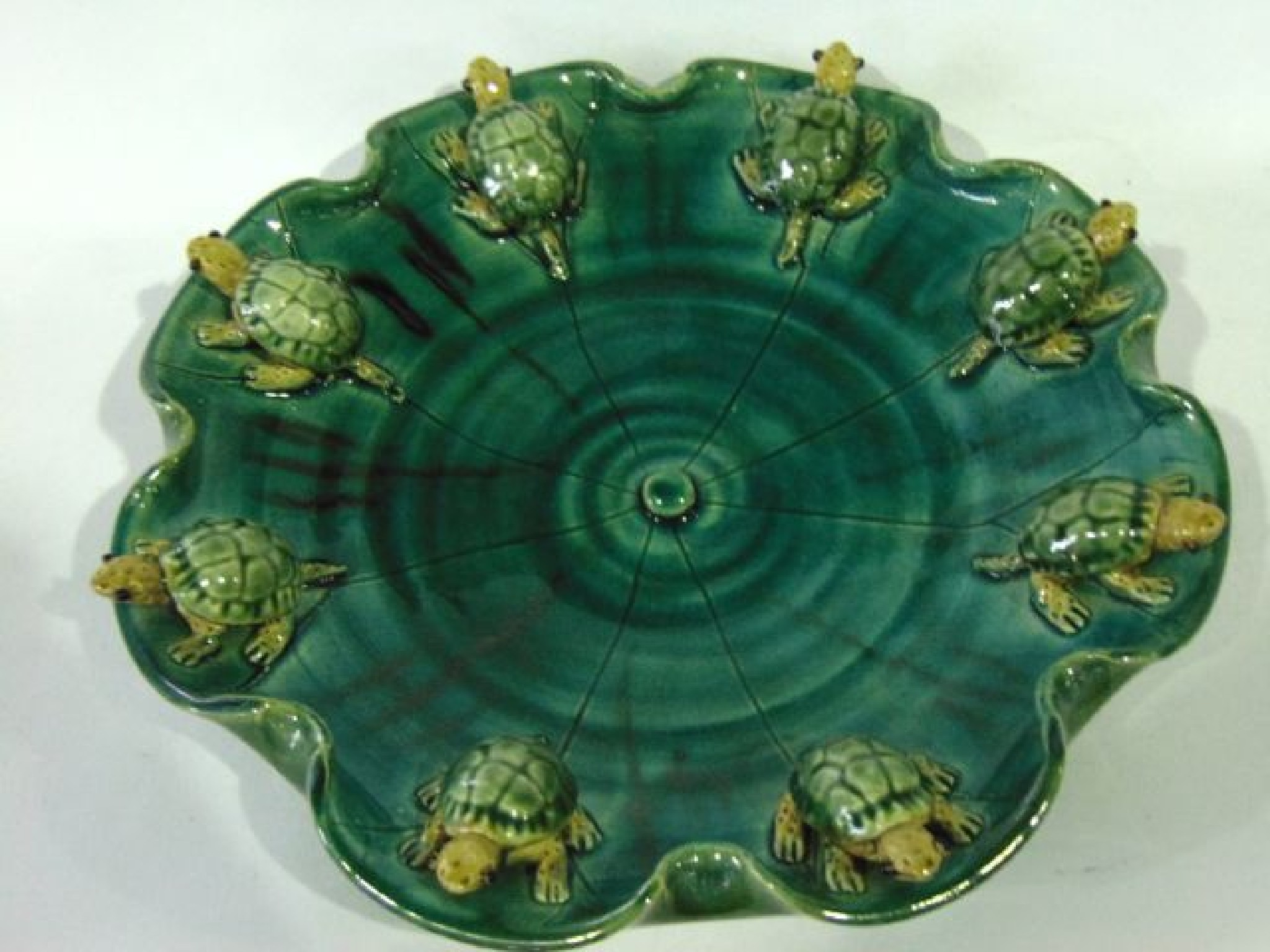 Appraisal: A green glazed dish of circular form in the oriental