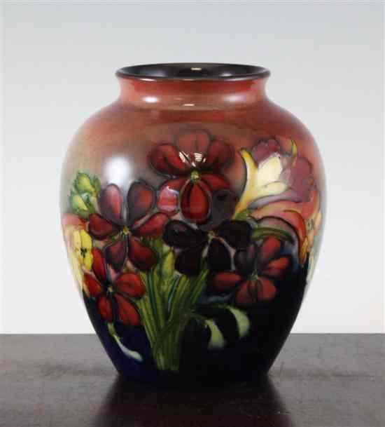 Appraisal: A Walter Moorcroft flambe 'Spring' flowers pattern ovoid vase inscribed