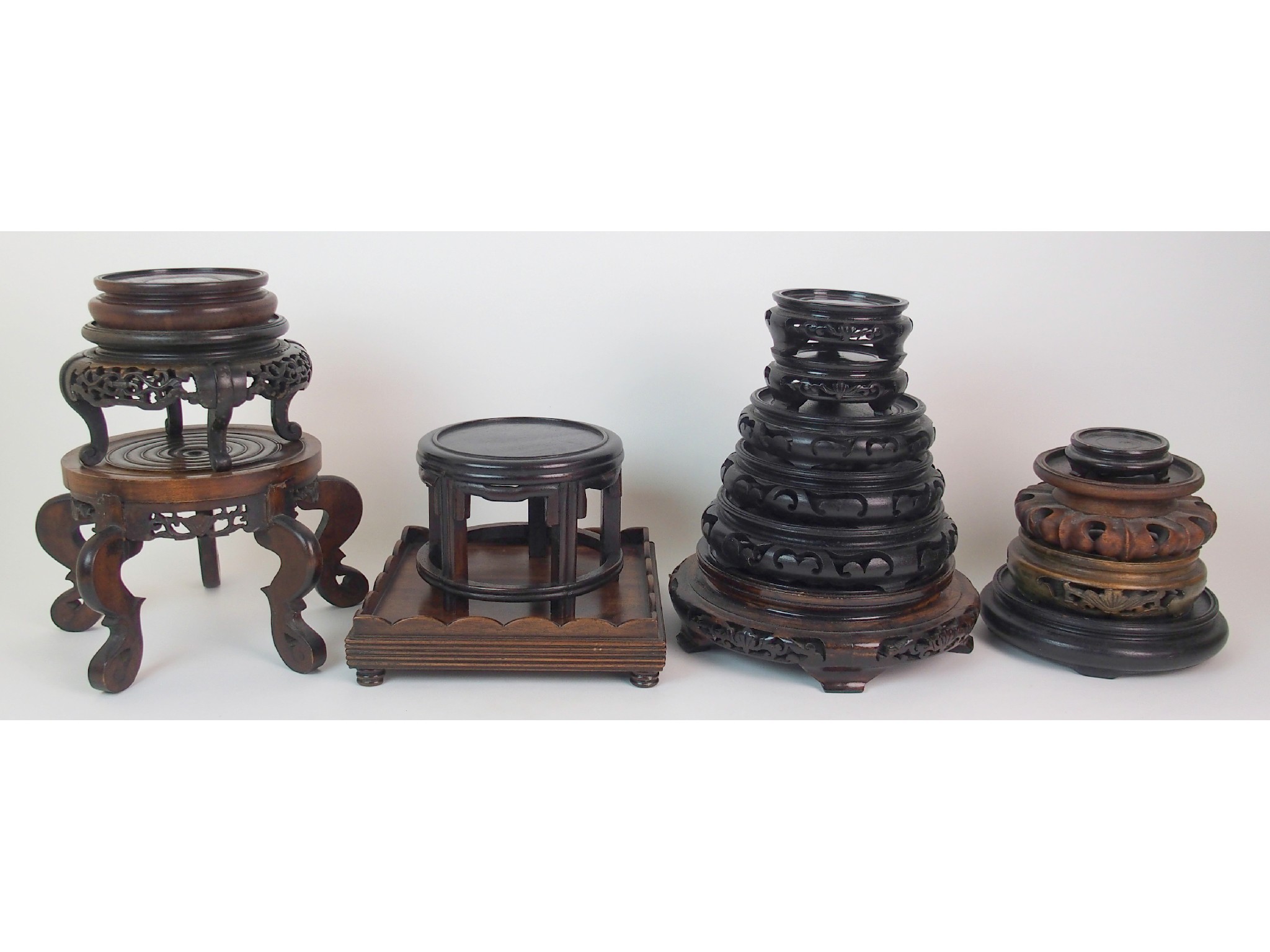 Appraisal: A quantity of Chinese carved wood vase standsvarious sizes