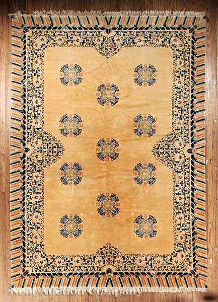 Appraisal: A Contemporary Chinese Rug salmon ground quatrefoil floral and bat