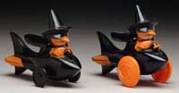 Appraisal: TWO WITCHES ON ROCKETS Both orange witches ride black rockets