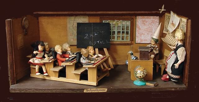 Appraisal: Diorama German schoolhouse Seven German cloth children one is sitting