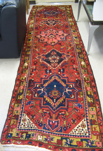 Appraisal: PERSIAN HAMADAN RUNNER five geometric medallion and overall stylized floral