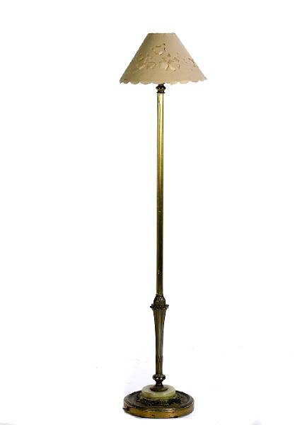 Appraisal: A patinated metal and onyx base floor lamp height to