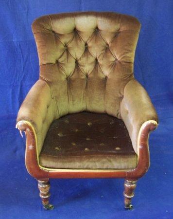 Appraisal: A Victorian armchair the buttoned back and seat to scroll