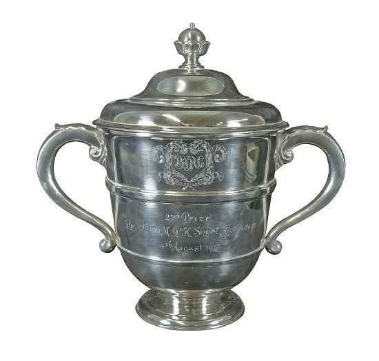 Appraisal: A trophy the domed circular lid with bud finial the