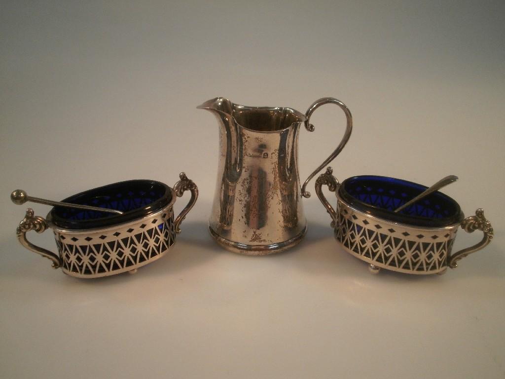 Appraisal: A pair of Victorian silver salts with pierced decoration blue