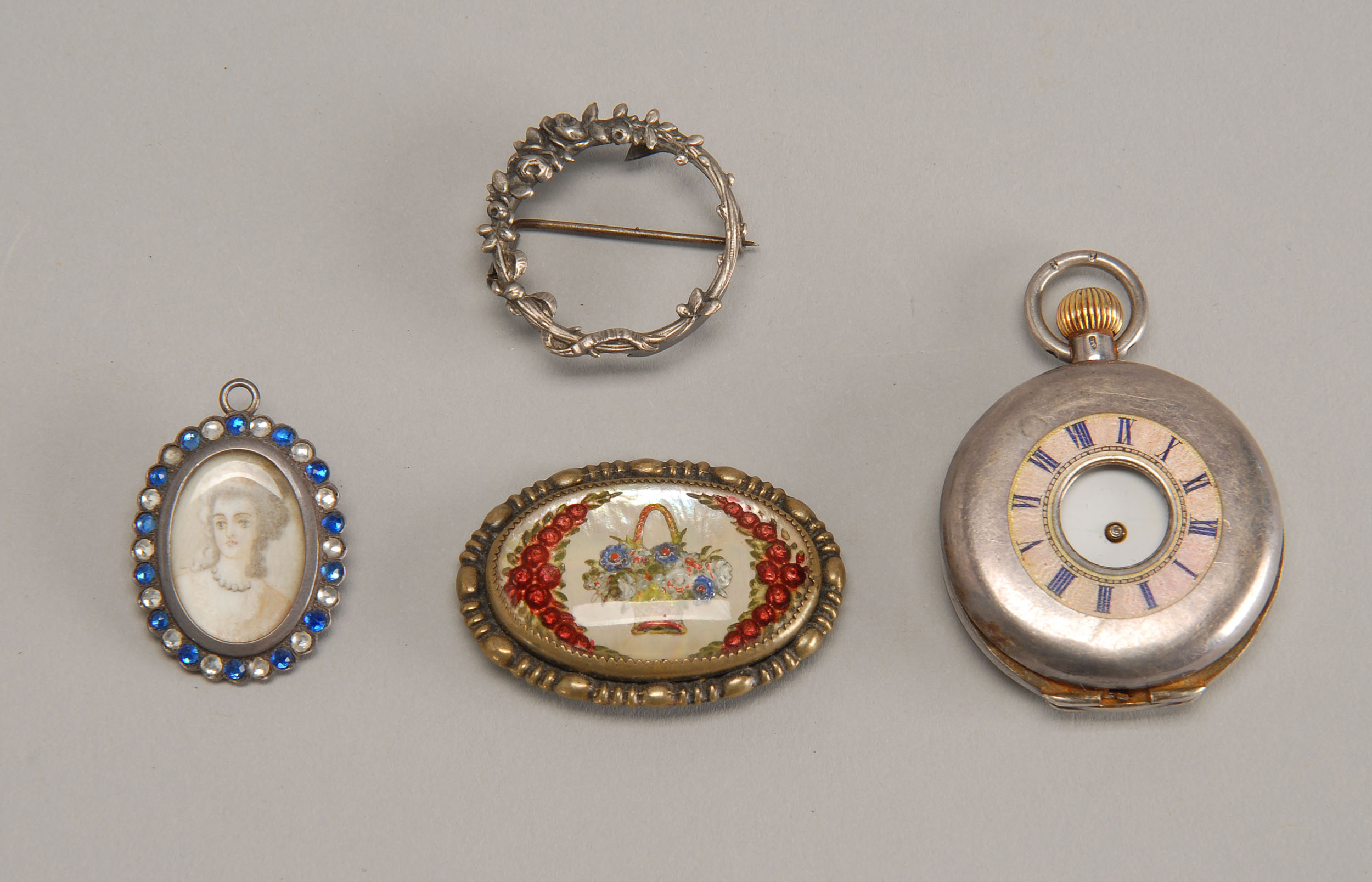 Appraisal: FOUR JEWELRY ITEMS A sterling silver-cased pocket watch and three