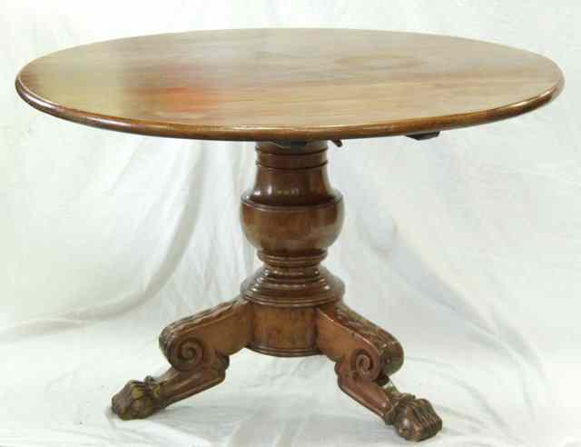 Appraisal: A Dutch colonial circular table the single plank top on