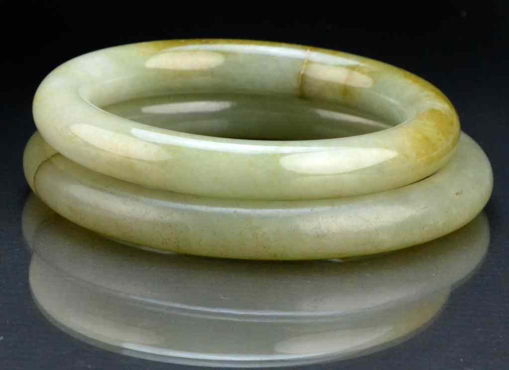 Appraisal: Chinese Qing Celedon Jade Bangle BraceletsFinely carved and polished one