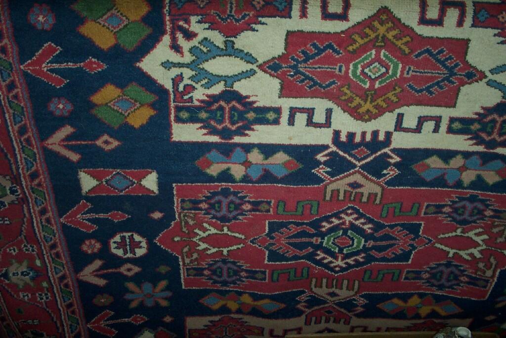 Appraisal: A blue ground Eastern wool carpet with stylised floral hooked