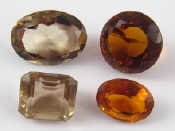 Appraisal: A mixed lot comprising four loose polished gemstones two smokey