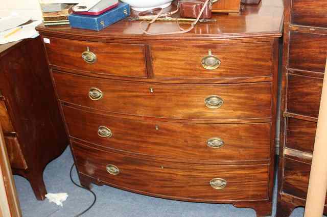 Appraisal: A VICTORIAN MAHOGANY BOW FRONTED CHEST of two short and