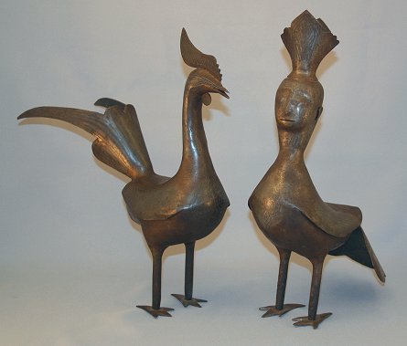 Appraisal: PAIR OF MIDDLE EASTERN METAL FIGURAL BIRDS Age unknown silver