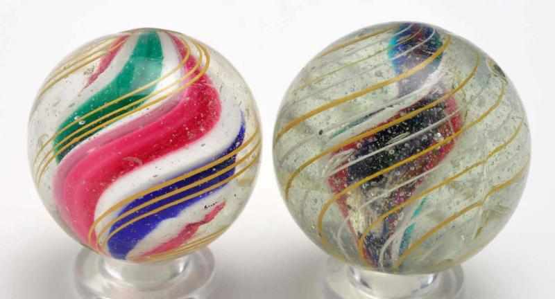 Appraisal: Lot of Swirl Marbles Description The smaller marble is a