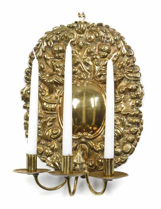 Appraisal: A French Three-Light Hammered Brass Sconce th century having two