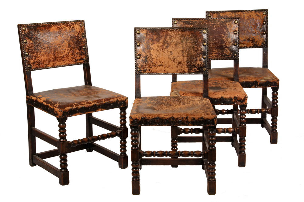 Appraisal: LEATHER UPHOLSTERED CHAIRS - th c English Oak Tudor Style