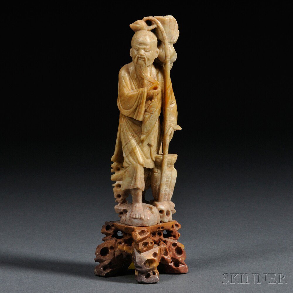 Appraisal: Soapstone Carving of an Immortal China th century standing on