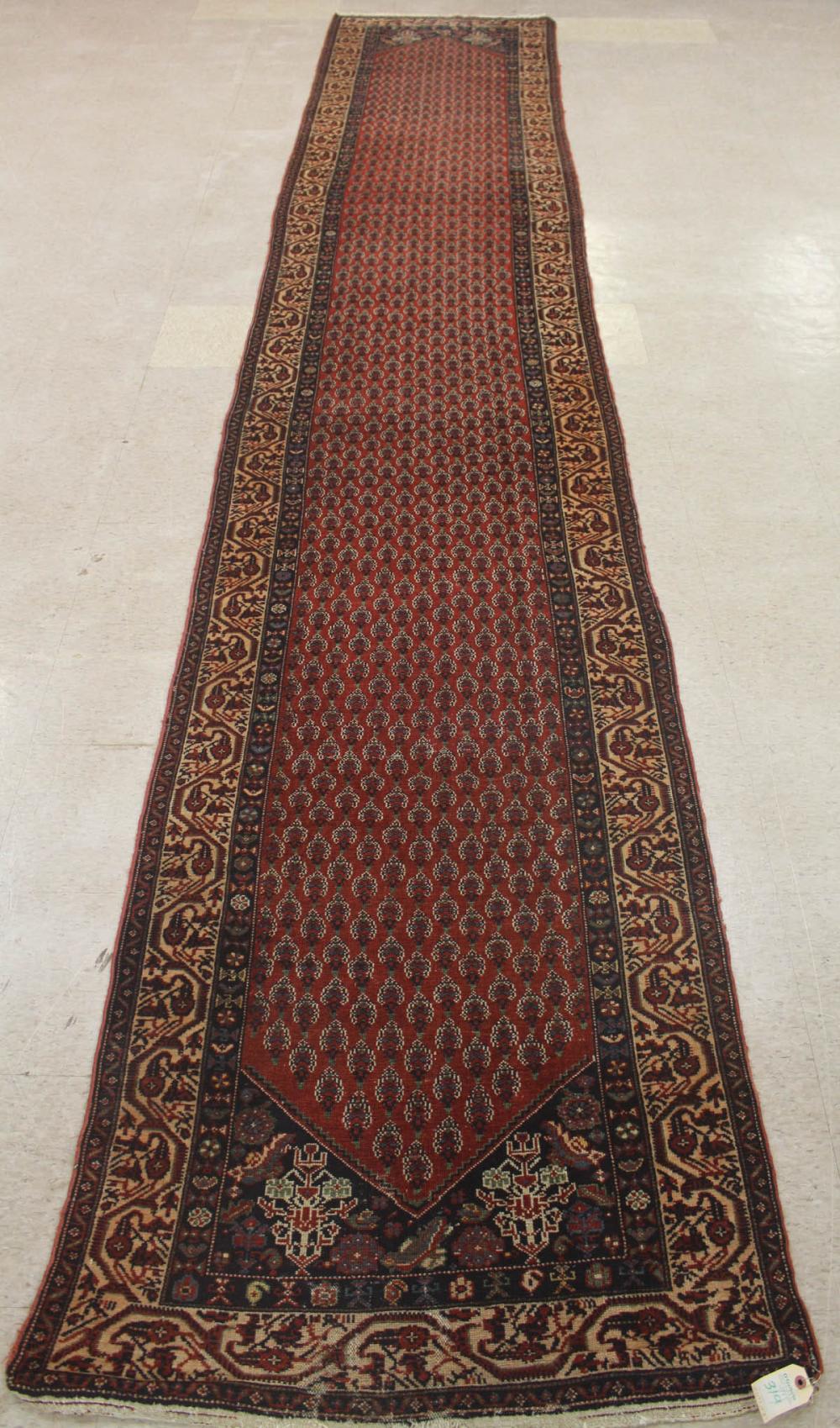 Appraisal: ANTIQUE PERSIAN SERABEND RUNNER hand knotted 'Mir' design of repeating