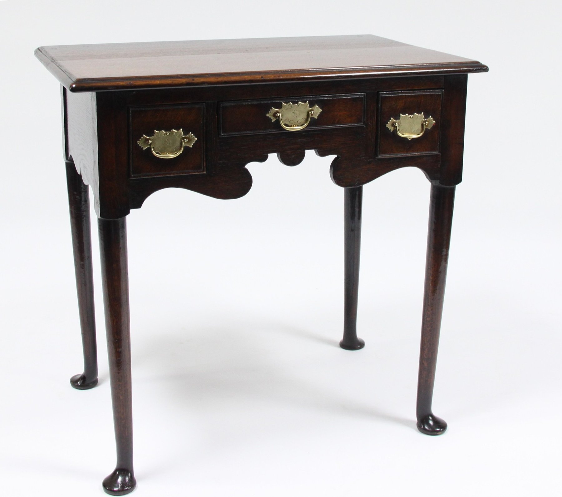 Appraisal: A George II oak low boy with three drawers and