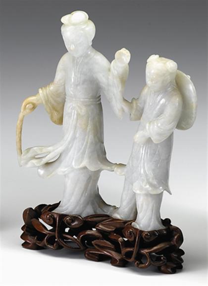 Appraisal: Chinese jadeite grouping th century Carved to show a female