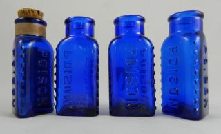 Appraisal: Poison bottles Poison- cobalt triangular three corners have knobs square