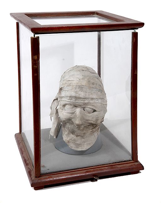 Appraisal: AUTOMATON CASED MUMMY HEAD AUTOMATON CASED MUMMY HEAD AN UNUSUAL