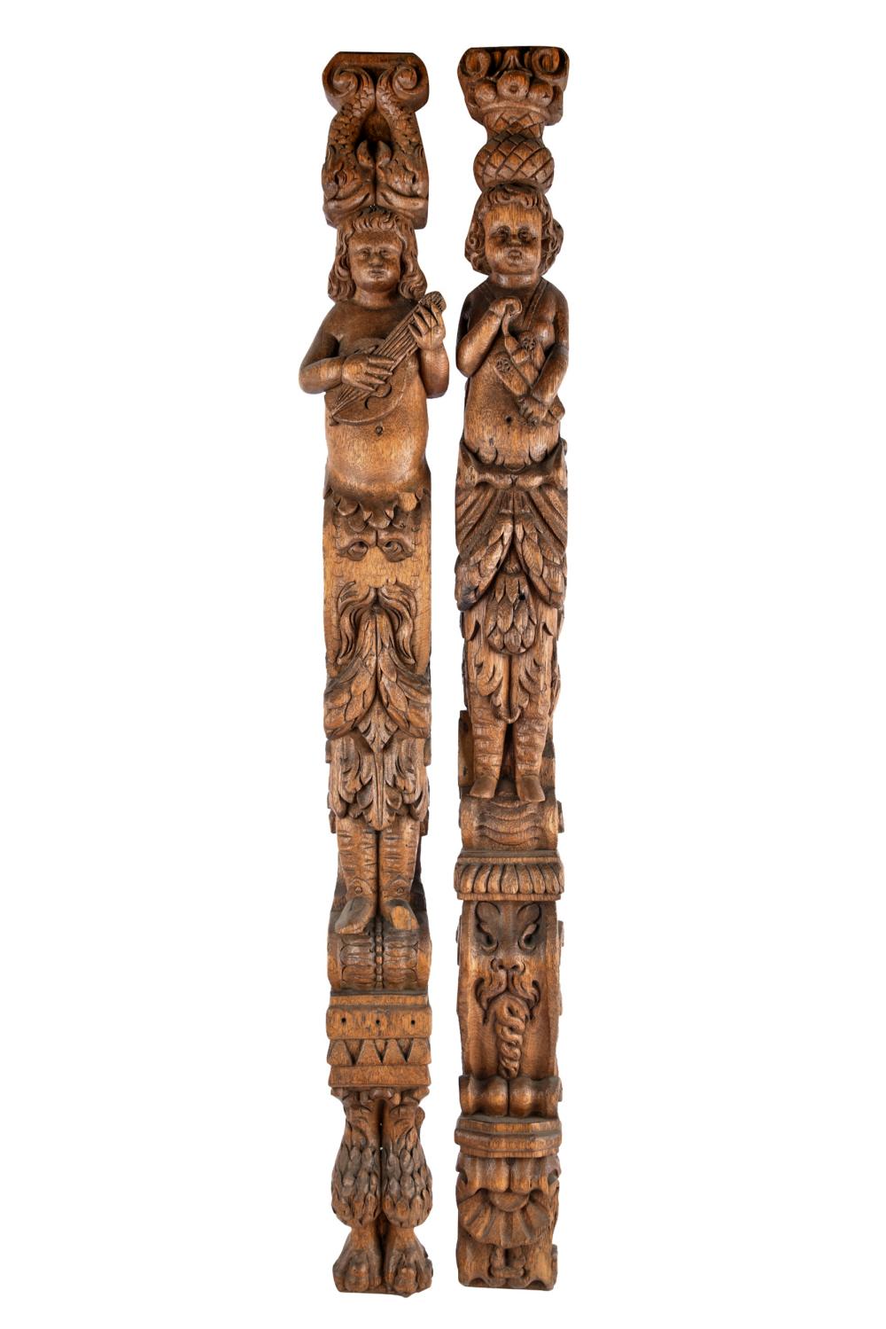 Appraisal: PAIR OF SPANISH CARVED WOOD PILLARSfigural design Condition with hanging