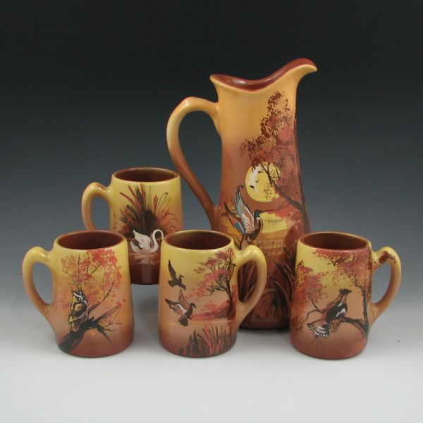 Appraisal: Rick Wisecarver five-piece tankard set with various bird scenes All