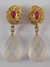 Appraisal: A pair of yellow metal tests carat gold cabochon ruby