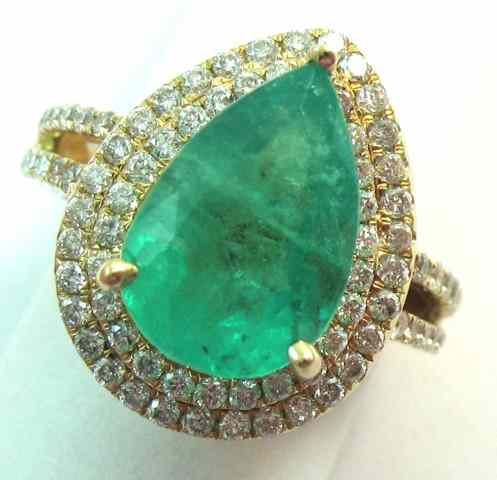 Appraisal: EMERALD AND DIAMOND RING k yellow gold with round-cut diamonds