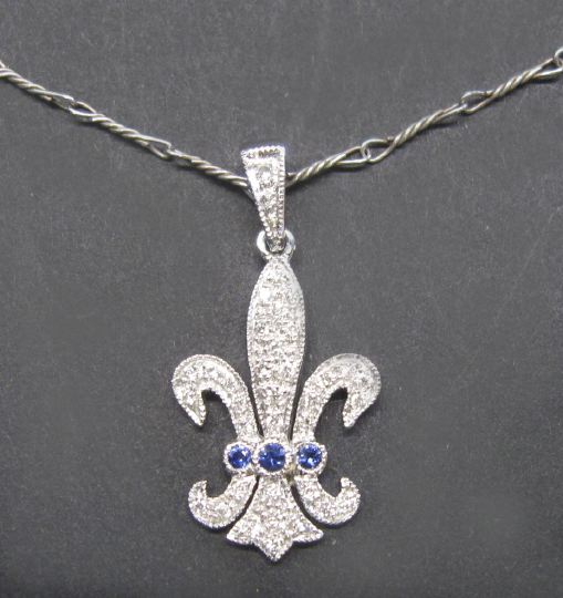 Appraisal: Eighteen-Karat White Gold Sapphire and Diamond Fleur-de-Lis Pendant Necklace composed